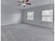 Large bedroom featuring plush carpeting and natural light from two windows at 10343 Waveland Cir, Fishers, IN 46038