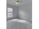 Bright bedroom featuring a ceiling fan, plush carpeting, and a window allowing natural light at 10343 Waveland Cir, Fishers, IN 46038