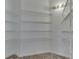 Empty closet with metal shelving and tile flooring, ready to be organized and filled at 10343 Waveland Cir, Fishers, IN 46038