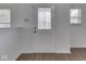 A white front door featuring an decorative glass design with side panels, set against a backdrop of white walls at 10343 Waveland Cir, Fishers, IN 46038