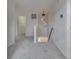 Upstairs hallway with unique lighting, carpet, and stairs leading to lower level at 10343 Waveland Cir, Fishers, IN 46038