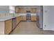 A close-up view of the kitchen with stainless steel appliances and beautiful granite countertops at 10343 Waveland Cir, Fishers, IN 46038