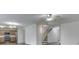Open-concept living area showcasing wood flooring and a connecting kitchen with modern appliances at 10343 Waveland Cir, Fishers, IN 46038