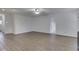 Expansive living space with wood flooring, neutral walls, and a ceiling fan for added comfort at 10343 Waveland Cir, Fishers, IN 46038