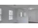 Bright living room featuring neutral walls and natural light through white-trimmed windows at 10343 Waveland Cir, Fishers, IN 46038