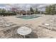 A luxurious swimming pool with plenty of lounge chairs and tables, perfect for relaxation and enjoyment at 10343 Waveland Cir, Fishers, IN 46038