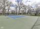 Well maintained tennis courts with new blue surface available for community use at 10343 Waveland Cir, Fishers, IN 46038