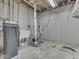 A view of the utility room with sink, water filtration system, and concrete floor at 10343 Waveland Cir, Fishers, IN 46038