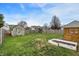 Backyard featuring a deck, storage shed, play set, and gardening beds, perfect for Gathering fun at 1086 Meadowview Ct, Franklin, IN 46131