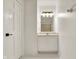 Bathroom showcasing a vanity sink with cabinetry and a decorative modern light fixture at 1086 Meadowview Ct, Franklin, IN 46131