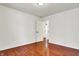 Bedroom with hardwood floors, a window, and a door at 1086 Meadowview Ct, Franklin, IN 46131