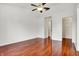 An airy bedroom with hardwood flooring and a ceiling fan, awaiting personal touches at 1086 Meadowview Ct, Franklin, IN 46131