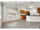 Open dining area with tile flooring, chandelier, and kitchen views at 1086 Meadowview Ct, Franklin, IN 46131