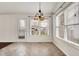 Bright dining area features a chandelier, large windows, and tile flooring at 1086 Meadowview Ct, Franklin, IN 46131