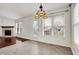 Dining area with tile floors, chandelier, and views of the backyard at 1086 Meadowview Ct, Franklin, IN 46131