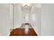 Bright entryway with hardwood flooring, white walls, and a decorative glass front door at 1086 Meadowview Ct, Franklin, IN 46131