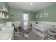 Inviting Bedroom features soft colors, a cozy glider, and a bright window at 10946 Snowdrop Way, Indianapolis, IN 46235