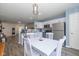 Eat-in kitchen featuring stainless steel appliances and a white dining table set at 10946 Snowdrop Way, Indianapolis, IN 46235