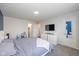 Spacious main bedroom boasts natural light, plush carpet, and access to en-suite bathroom at 10946 Snowdrop Way, Indianapolis, IN 46235