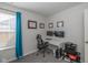 Well-lit home office with dual monitors and comfortable seating at 10946 Snowdrop Way, Indianapolis, IN 46235
