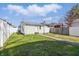A fenced backyard features a grassy area at 1135 E Southern Ave, Indianapolis, IN 46203
