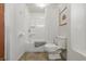 The well-lit bathroom includes a shower and tub combination at 1135 E Southern Ave, Indianapolis, IN 46203