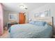 Bright bedroom with a bed, desk, and ample natural light, perfect for relaxation at 1135 E Southern Ave, Indianapolis, IN 46203
