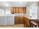 Functional kitchen with wooden cabinets, and appliances at 1135 E Southern Ave, Indianapolis, IN 46203