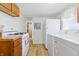 Bright kitchen featuring modern appliances and flooring, with a washer/dryer at 1135 E Southern Ave, Indianapolis, IN 46203