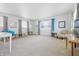 Spacious living room with neutral carpet, large windows, and ample natural light at 1135 E Southern Ave, Indianapolis, IN 46203