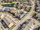 Aerial view of a residential neighborhood with mature trees and ponds at 12895 Grenville St, Carmel, IN 46032