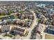 Aerial view of a residential area with a pond and mature trees at 12895 Grenville St, Carmel, IN 46032
