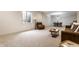 Spacious basement featuring carpet, a leather chair, and a dining area at 12895 Grenville St, Carmel, IN 46032