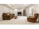 Spacious basement featuring carpet flooring, a sofa, recliner, and natural light at 12895 Grenville St, Carmel, IN 46032