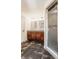 Bathroom boasts double vanity, a glass-enclosed shower, and stylish dark tile floors at 12895 Grenville St, Carmel, IN 46032