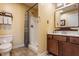 Well-lit bathroom with a walk-in shower, vanity, and modern fixtures at 12895 Grenville St, Carmel, IN 46032