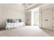 Bright bedroom with plush carpet, tray ceilings, a daybed, and closet at 12895 Grenville St, Carmel, IN 46032
