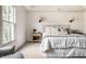 Bedroom featuring plush carpet, ambient lighting, and natural light from a window at 12895 Grenville St, Carmel, IN 46032