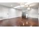 Open bonus room boasts shiny floor, white walls, and contemporary lighting at 12895 Grenville St, Carmel, IN 46032