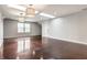 Bright bonus room featuring polished floor, natural light, and updated lighting fixtures at 12895 Grenville St, Carmel, IN 46032