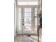 Inviting front door with sidelights and transom window, offering a glimpse of the neighborhood at 12895 Grenville St, Carmel, IN 46032