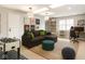 Fun game room with a foosball table, large sectional, and 'Let's Play' art at 12895 Grenville St, Carmel, IN 46032