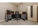 A well-organized home office featuring a desk, computer setup, and a storage cabinet at 12895 Grenville St, Carmel, IN 46032