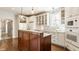 Bright kitchen with custom cabinets, stainless steel appliances, and an island at 12895 Grenville St, Carmel, IN 46032