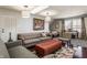 Cozy living room featuring comfortable seating, a skylight, and unique decor accents at 12895 Grenville St, Carmel, IN 46032