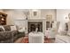 Inviting living room with a fireplace, comfortable seating, and a cozy atmosphere for relaxation at 12895 Grenville St, Carmel, IN 46032