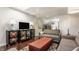 Bright living room with stylish furnishings, entertainment center, and adjacent seating area at 12895 Grenville St, Carmel, IN 46032