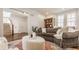 Spacious living room with hardwood floors, a fireplace, and a comfortable couch at 12895 Grenville St, Carmel, IN 46032