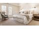 Serene primary bedroom features a sitting area, soft lighting, and a plush bed at 12895 Grenville St, Carmel, IN 46032