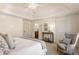 Bright primary bedroom features a sitting area and a doorway into a primary ensuite at 12895 Grenville St, Carmel, IN 46032